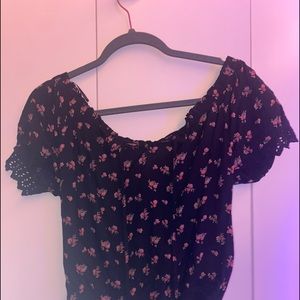 Off shoulder. Black with flower pattern